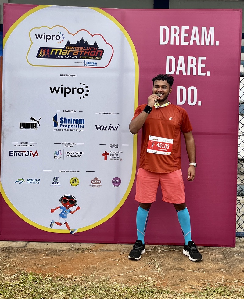 Aayush at marathon with medal